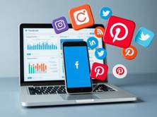 A laptop and smartphone showing social media dashboards with likes, shares, and engagement icons. Icons for Facebook, Instagram, LinkedIn, Twitter, and Pinterest floating around, representing free website promotion on social media.