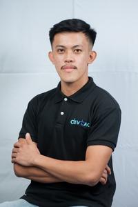 a man in a black shirt is posing for a picture